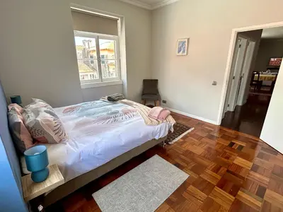 a bedroom with a bed and a window at Apartment Minorca in Funchal