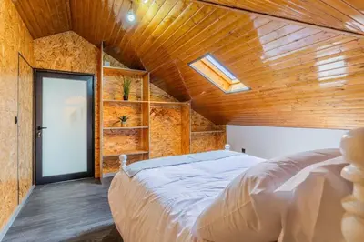 a bedroom with a bed and a wooden ceiling at Dona Maria - Tronco da Serra in Campanário