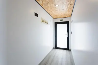 an empty hallway with a door in a building at Dona Maria - Tronco da Serra in Campanário