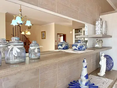 a counter with blue and white vases on it at Casa sol nascente do Caniçal in Caniçal
