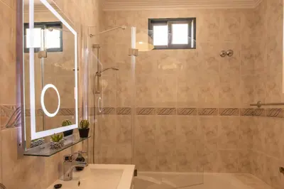 a bathroom with a shower and a sink at Casa sol nascente do Caniçal in Caniçal