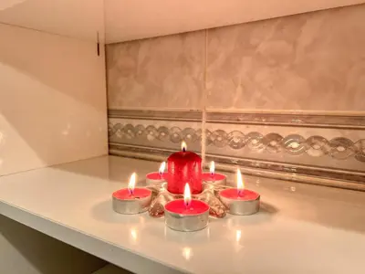 a group of four candles sitting on a counter at Casa sol nascente do Caniçal in Caniçal