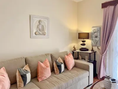 a living room with a couch with pillows on it at Casa sol nascente do Caniçal in Caniçal