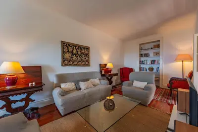 a living room with a couch and a piano at FLH Funchal Casa do Carvalhal in Funchal