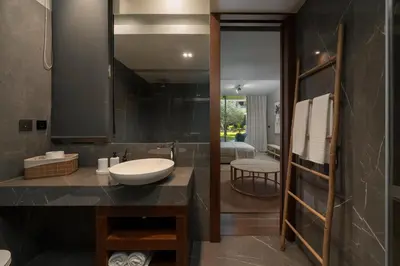 a bathroom with a sink and a mirror at Savoy Residence Casa Branca III by An Island Apart in Funchal