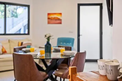 a dining room with a table and chairs at Tornos in Funchal