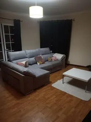 a living room with a couch and a coffee table at Madeira house garden Villa in Estreito de Câmara de Lobos