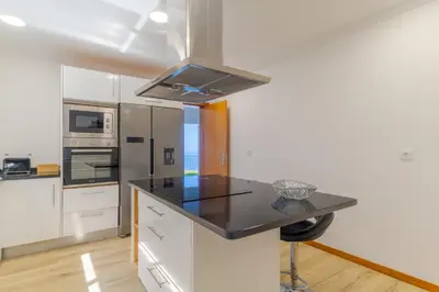 a kitchen with a black counter top in a room at Villa Quinta Grande by Holiday rental Madeira in Quinta Grande