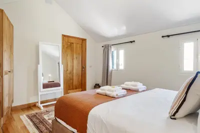 a bedroom with a bed with towels on it at Harmony Retreat by Homie in Ponta do Sol