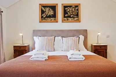 a bedroom with a bed with towels on it at Harmony Retreat by Homie in Ponta do Sol