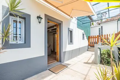 a hallway of a house with a door and plants at Harmony Retreat by Homie in Ponta do Sol