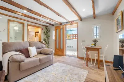 a living room with a couch and a table at Harmony Retreat by Homie in Ponta do Sol