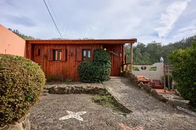 a kitchen and dining room with a table and chairs at Casas Maravilha by Homie in Calheta