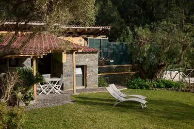 a kitchen with wooden walls and a counter top at Casas Maravilha by Homie in Calheta