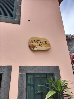 a bedroom with two beds and a mirror on the wall at Cantinho DC in Funchal