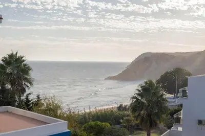 a view of the ocean from a building at Apartamentos Jorge Águas - 2Bedroom in the town of Burgau - Sea view in Burgau