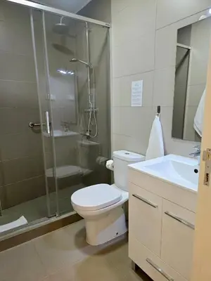 a kitchen with white cabinets and a washer and dryer at Upgrade Paradise Apartments Funchal City Centre in Funchal