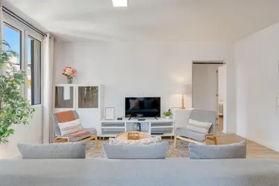 a living room with a couch and a table at Upgrade Paradise Apartments Funchal City Centre in Funchal
