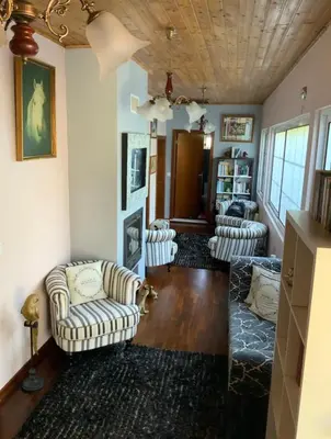 a living room with couches and a wooden ceiling at Quinta J.V. in Camacha