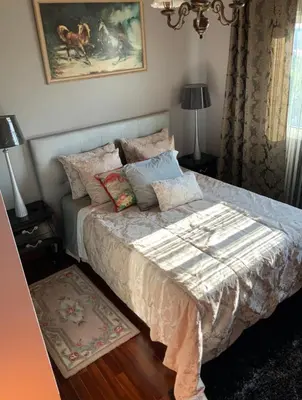 a bedroom with a bed with pillows on it at Quinta J.V. in Camacha