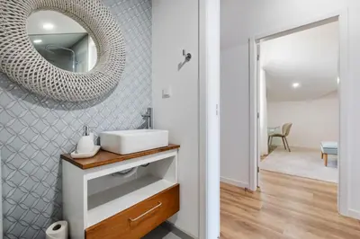 a bathroom with a sink and a mirror on the wall at Coastal Charm by Homie in Ponta do Sol
