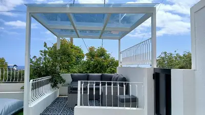 a balcony with a pillow on the grass at JPL Blue Horizon Residential - D in Câmara de Lobos