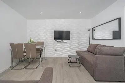 a living room with a couch and a table at JPL Blue Horizon Residential - D in Câmara de Lobos