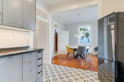 a kitchen and dining room with a table and chairs at Casa Trollis by Holiday Rental Madeira in Funchal