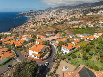 an aerial view of a town with orange roofs at Casa Trollis by Holiday Rental Madeira in Funchal