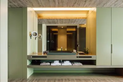 a bathroom with a sink and a large mirror at Saccharum - Resort and Spa - Savoy Signature in Calheta