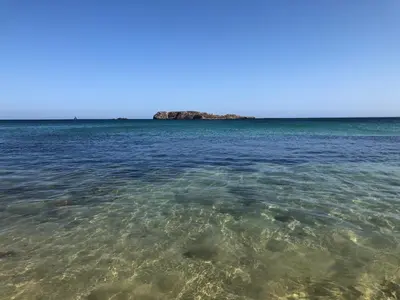 a large body of water with an island in the distance at Casa da Bisa in Sagres