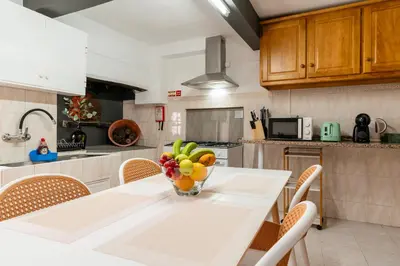 a hallway of a house with a living room at Casa da Tia in Arco da Calheta
