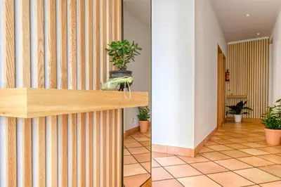 a lobby with a counter with plants on it at Clarisse's House II, a Home in Madeira in Ponta do Sol