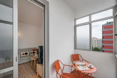 a room with a table and chairs and a window at Apartamento América by An Island Apart in Funchal