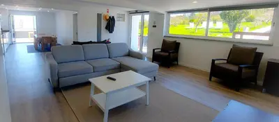 a living room with a couch and a table at Quintinha das Achadas in Achadas da Cruz