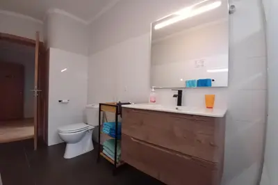 a bathroom with a sink and a toilet at AL - Perola Dourada in Santana