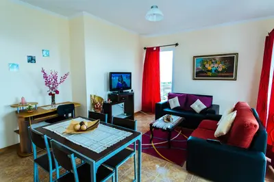 a living room with a couch and a table at AL - Perola Dourada in Santana
