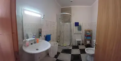 a bathroom with a sink and a shower and a toilet at AL - Perola Dourada in Santana