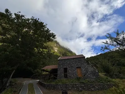 a small stone building on the side of a mountain at Casa do Batista in Seixal