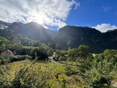 a view of a mountain with the sun shining on it at Casa do Batista in Seixal