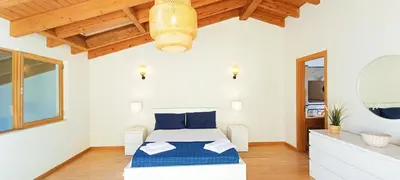 a bedroom with a bed and a mirror at Sagres Mar in Sagres