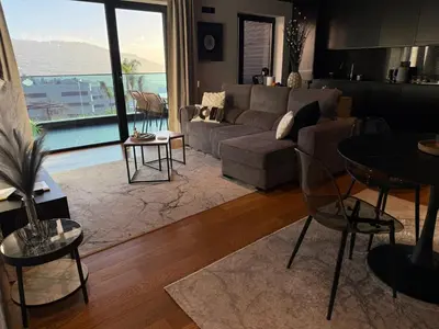 a living room with a couch and a table at Zukiryo Seaside by Rentallido in Funchal