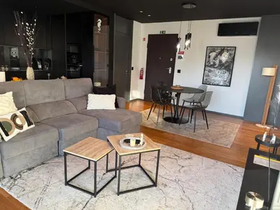 a living room with a couch and a table at Zukiryo Seaside by Rentallido in Funchal