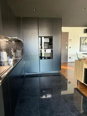 a kitchen with gray cabinets and a counter top at Zukiryo Seaside by Rentallido in Funchal