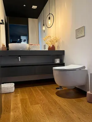 a bathroom with a white toilet and a sink at Zukiryo Seaside by Rentallido in Funchal