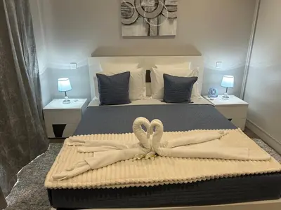a bedroom with a bed with two towels on it at Villa Diogo in Ponta do Sol