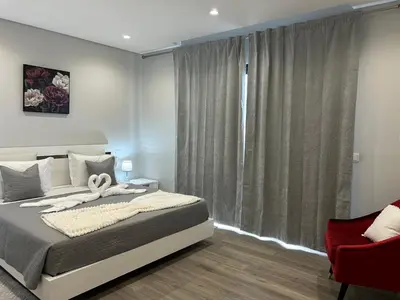 a bedroom with a bed and a large window at Villa Diogo in Ponta do Sol