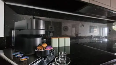 a kitchen with a coffee pot on a stove at Blissful Suite by LovelyStay in Funchal