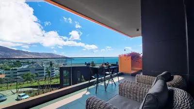 a room with a balcony with a view of the ocean at Blissful Suite by LovelyStay in Funchal