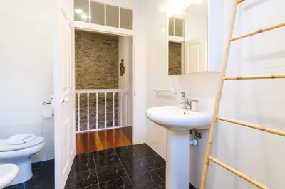 a bathroom with a sink and a toilet at GuestReady - Peaceful haven in Funchal in Funchal